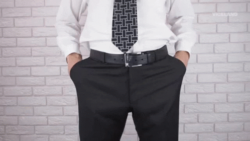 Man In White Shirt With Hands In Pockets GIF