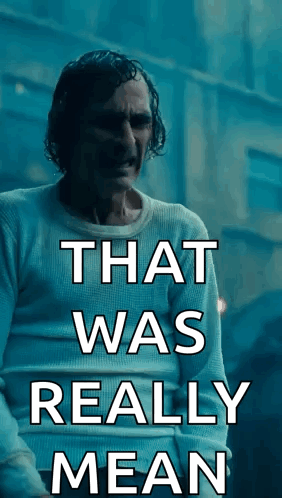 Man in White Shirt with Mean Words