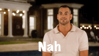 Man in White Shirt with Nah Text at House