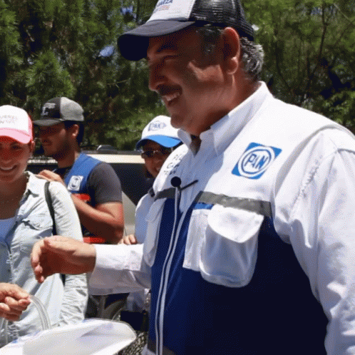Man in White Shirt with Pn Logo