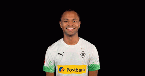 Man in White Shirt With Postbank Logo