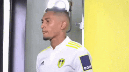 Man in White Shirt with Yellow Stripe