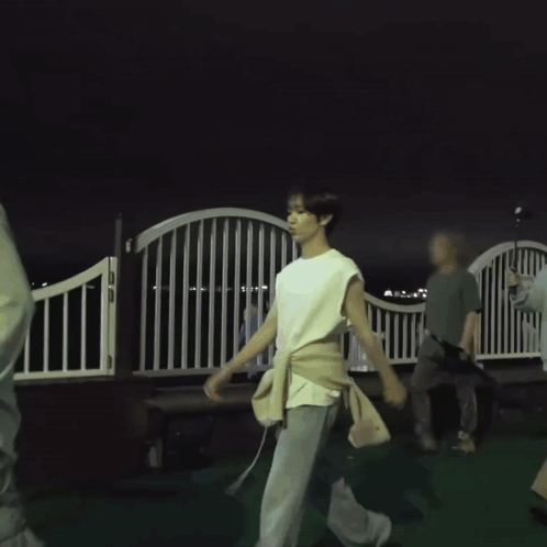 Man in White Sleeveless Shirt Walking