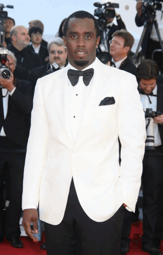 Man in White Suit and Black Bow Tie