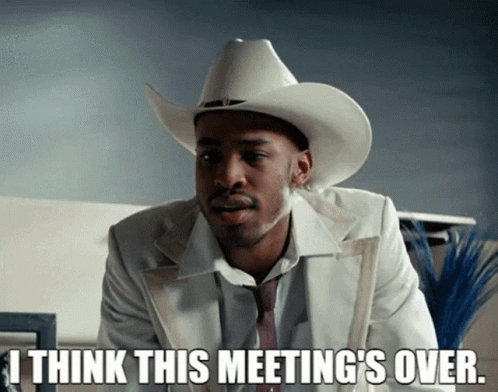 Man in White Suit and Cowboy Hat Says I Think This Meeting's Over