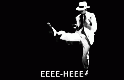 Man in White Suit and Hat Dancing Eee-Hee