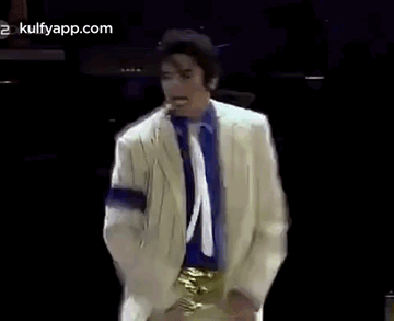 Man in White Suit Blue Shirt Dancing