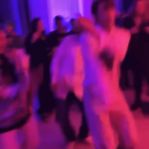 Man in White Suit Dancing