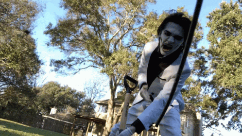 Man in White Suit Holding Sword