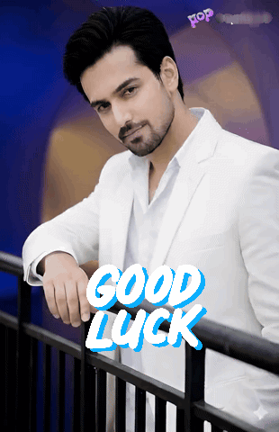 Man In White Suit Leaning On Railing Saying Good Luck GIF