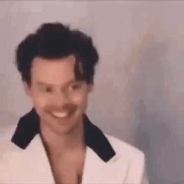 Man In White Suit Smiling GIF