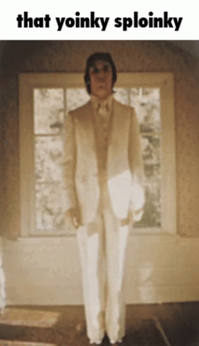 Man In White Suit With Yoinky Sploinky GIF
