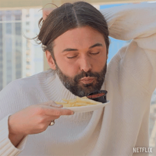 Man in White Sweater Eating Fries with Netflix Logo