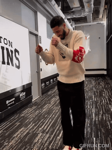 Man In White Sweater Near JetBlue Sign GIF
