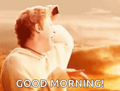 Man In White Sweater Saying Good Morning