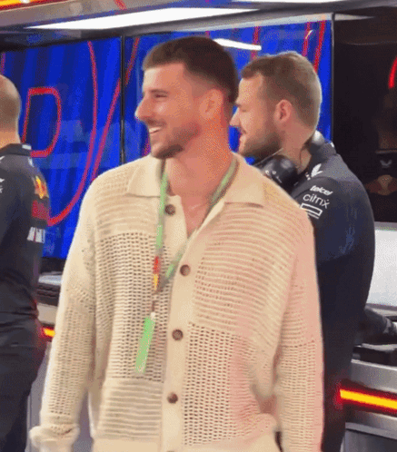 Man in White Sweater with Citrix Lanyard