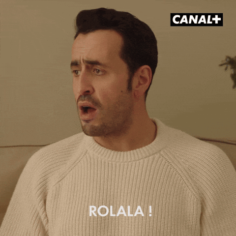 Man In White Sweater With Rolala GIF