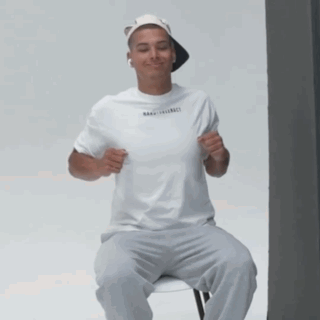 Man in White T-Shirt and Hat Smiling
