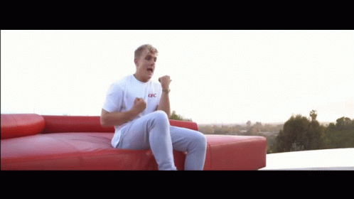 Man in White T-Shirt Fist Pumping