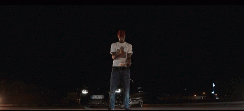 Man in White T-Shirt With Man Picture