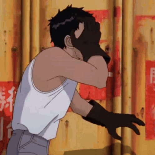 Man In White Tank Top And Black Gloves Facing Yellow Wall GIF