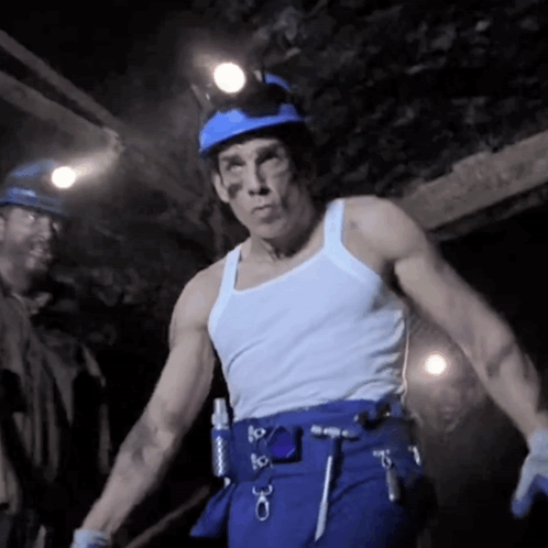 Man in White Tank Top and Blue Pants