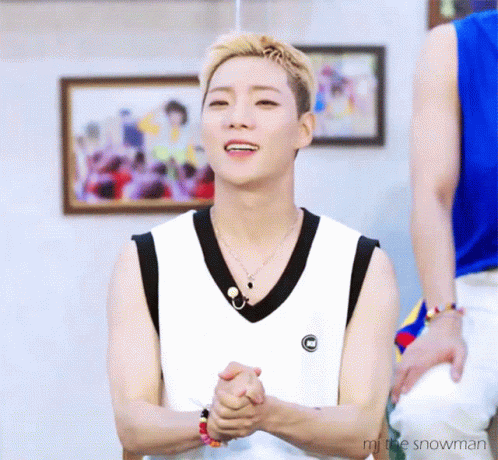 Man in White Tank Top and Necklace