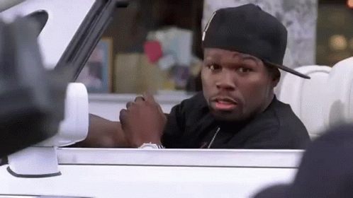 Man In White Tank Top Covering Face With Hands GIF