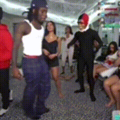 Man In White Tank Top Dancing In Front Of Crowd GIF