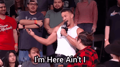 Man In White Tank Top Says I M Here GIF