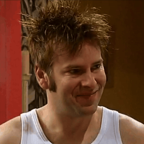 Man in White Tank Top Smiling