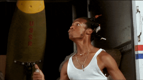 Man in White Tank Top With USSR Bomb