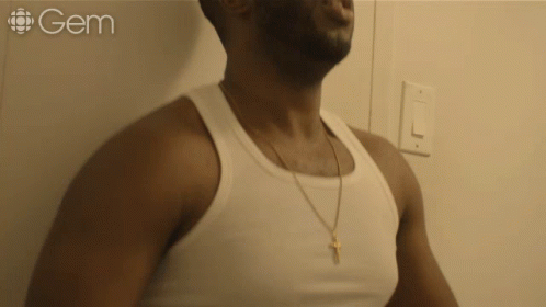 Man in White Tank Top With Word Gem