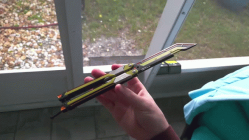 Man In White Tees Pointing Chef Knife GIF