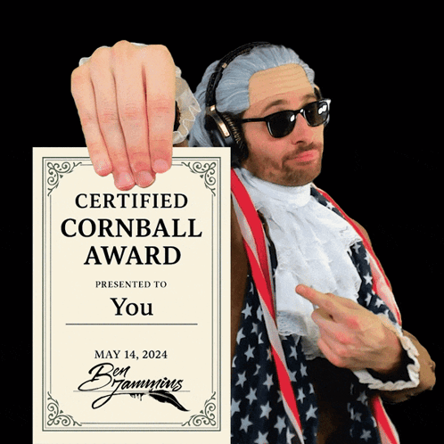 Man in Wig and Sunglasses Holding Certified Cornball Award Certificate