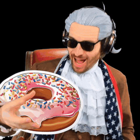 Man In Wig And Sunglasses Holding Donut With Sprinkles GIF