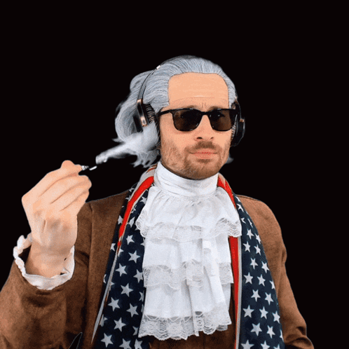 Man in Wig and Sunglasses Holding Pen