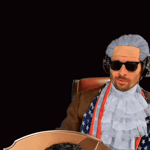 Man in Wig Next to Card Saying RW