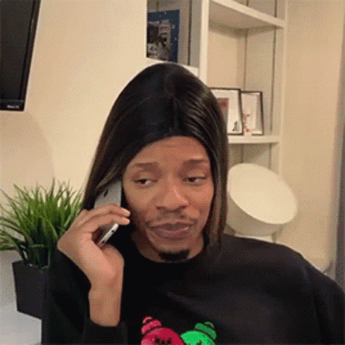 Man In Wig On Phone Making Funny Face GIF