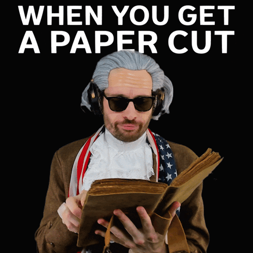 Man In Wig Reading 'When You Get A Paper Cut GIF