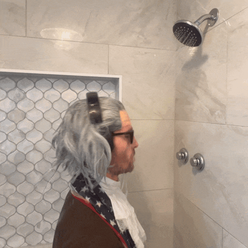 Man In Wig Taking Shower GIF