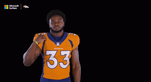 Man in Williams Jersey Flexing Muscles