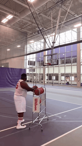Man in Wilson Jersey Holding Basketball
