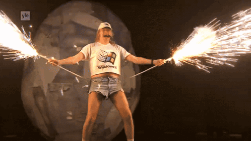 Man in Windows T-Shirt Holding Sparklers