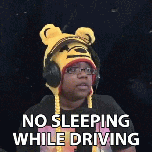 Man in Winnie the Pooh Hat and Headphones Making Funny Face While Driving
