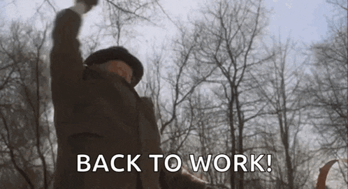 Man In Woods With Fist In Air Saying Back To Work GIF