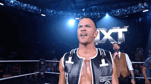 Man In Wrestling Ring With Absolute Vest GIF