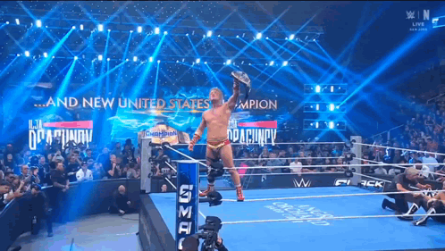 Man in Wrestling Ring With And New United States On Wall