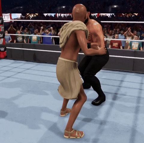 Man In Wrestling Ring With Apollo T-Shirt GIF