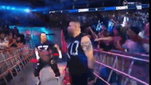 Man in Wrestling Ring With Crowd
